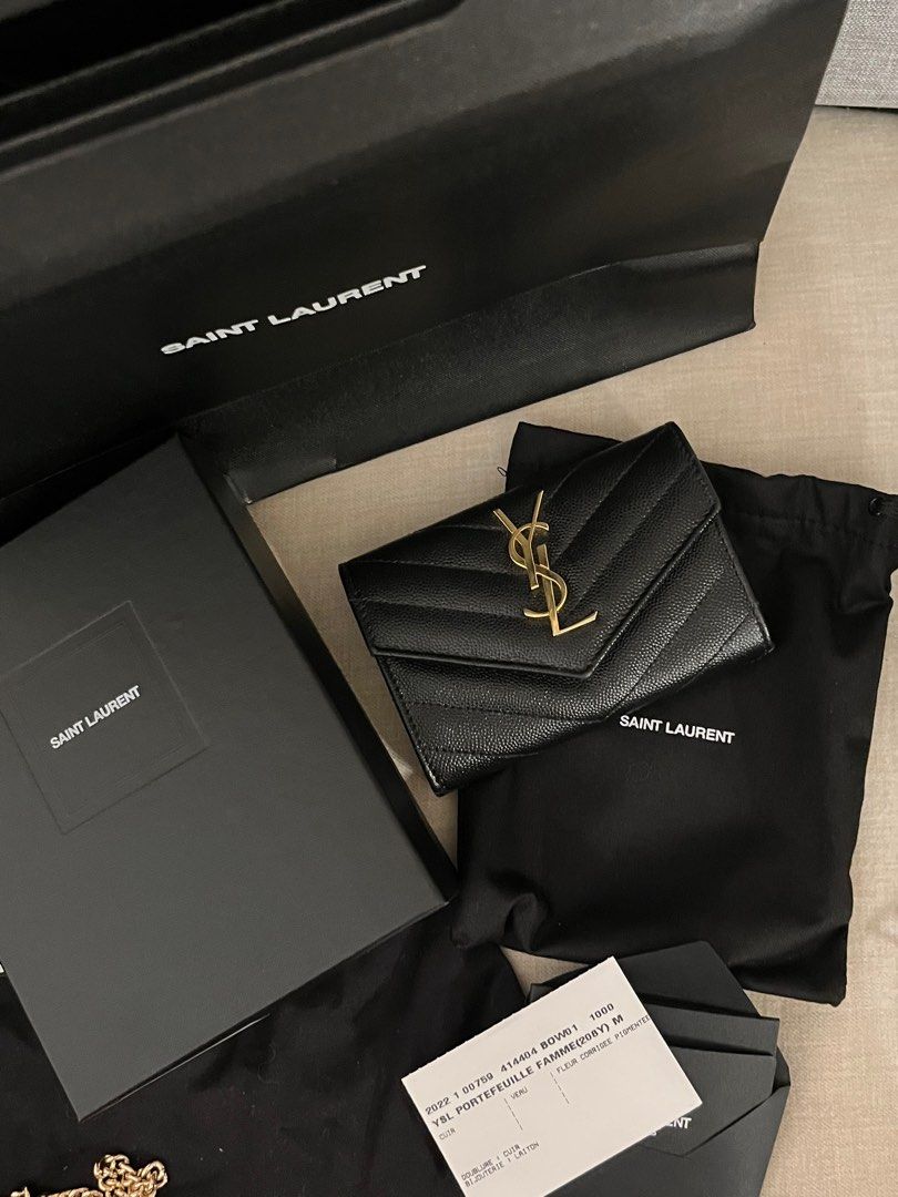 Saint Laurent YSL (Category: Luxury Bags & Wallets) located in Pasig City. Submitted by abbeyvt (Listing ID 1401837079, Image 3). Description: - Authentic Saint Laurent YSL Portefeuille Famme wallet - Black quilted leather exterior - Gold-tone hardware - Includes original box, dust bag, and authenticity card - Stylish and compact design.