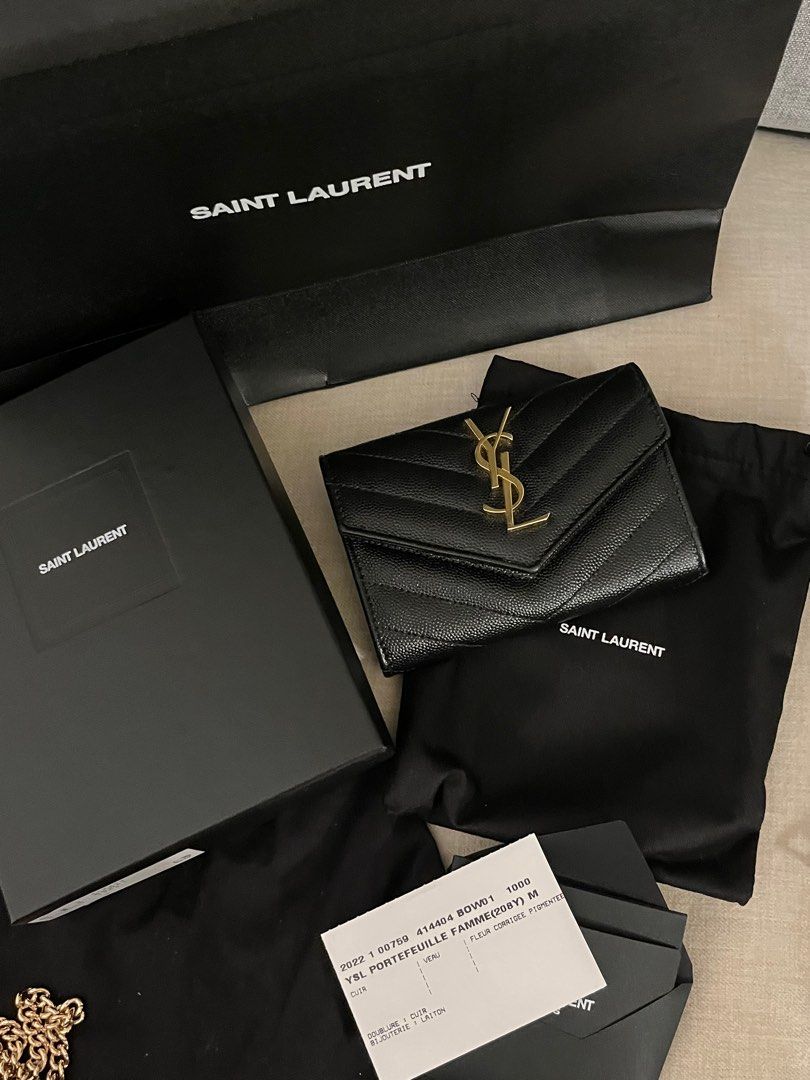 Saint Laurent YSL (Category: Luxury Bags & Wallets) located in Pasig City. Submitted by abbeyvt (Listing ID 1401837079, Image 2). Description: - Authentic Saint Laurent YSL Portefeuille Famme wallet - Black quilted leather exterior - Gold-tone hardware - Includes original box, dust bag, and authenticity card - Stylish and compact design.