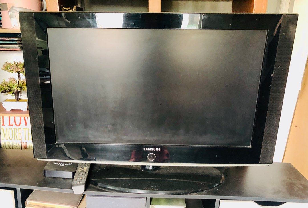 Samsung TV (Defective) (Category: TV) located in Makati City. Submitted by lynzkyyy (Listing ID 1401802229, Image 2). Description: - Samsung TV (34 X 20 inches) - Black frame - Includes remote control - Defective - With stand.