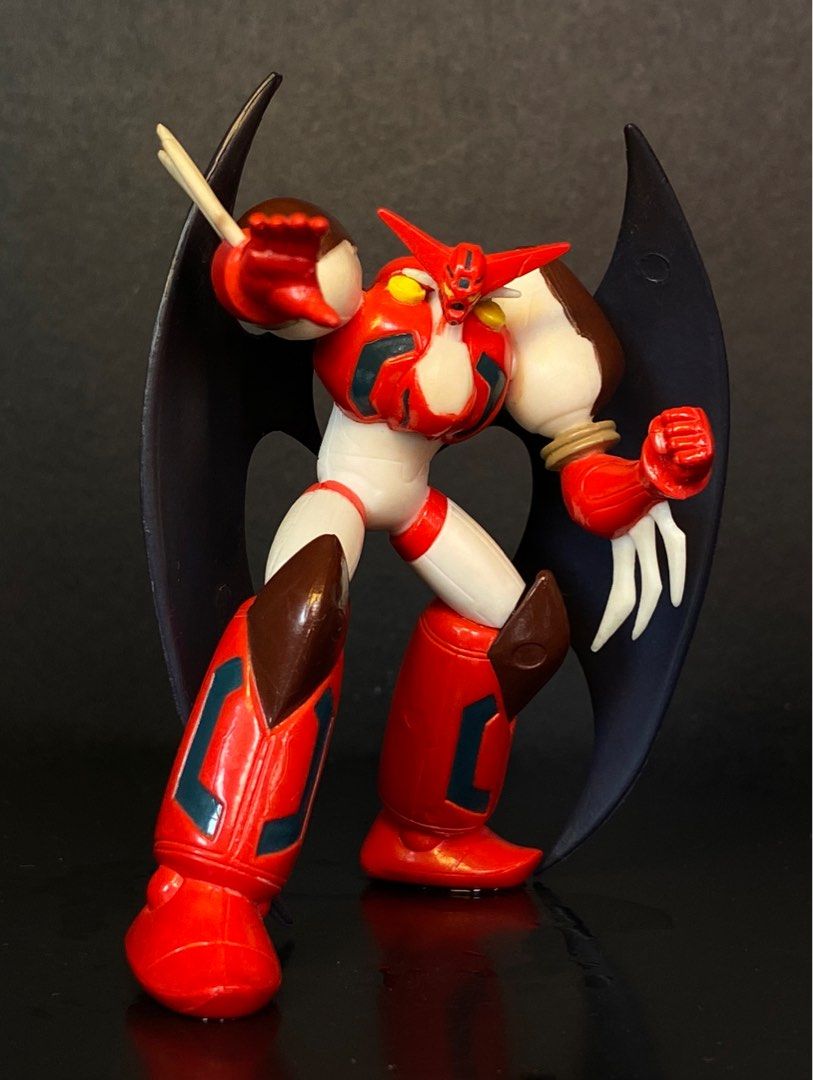 Shin getter getter robo Bandai (Category: Figurines & Statues) located in Agoo. Submitted by collect12 (Listing ID 1401746864, Image 1). Description: - Getter 1 action figure - Features a red, white, and brown color scheme - Includes black wings - Posed in a dynamic stance - Detailed paintwork and design - Made in China.