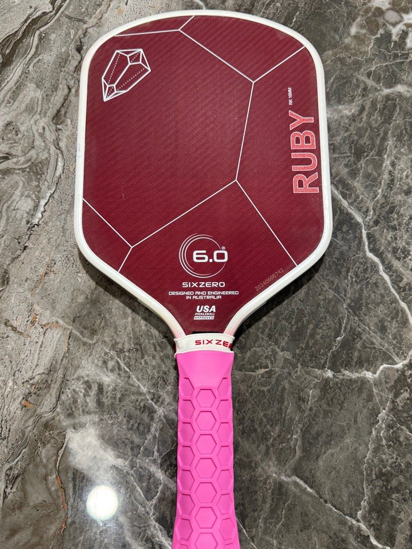 Pickleball Paddle Six Zero Ruby (Category: Racket & Ball Sports) located in Kampung Sungai Ara. Submitted by key3hky (Listing ID 1401828036, Image 2). Description: Used but well taken care Six Zero - Ruby Paddle. Good for ladies and control. Grip upgraded to ribbed type for better control. Side tape added at bottom thorat for Enhanced control/feel, added stability, minimal swing weight change.