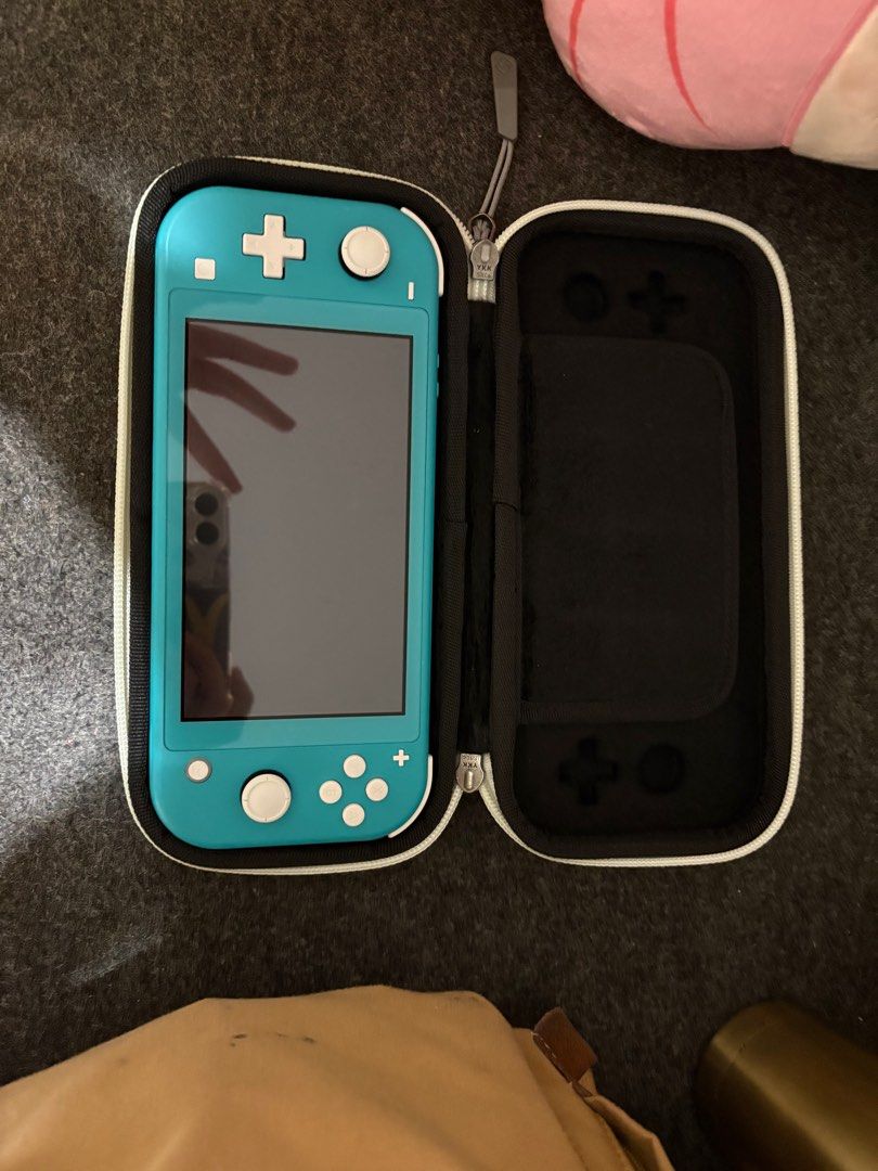 Switch lite (Category: Nintendo) located in Singapore. Submitted by supercarliftagilistic (Listing ID 1401745637, Image 1). Description: .
