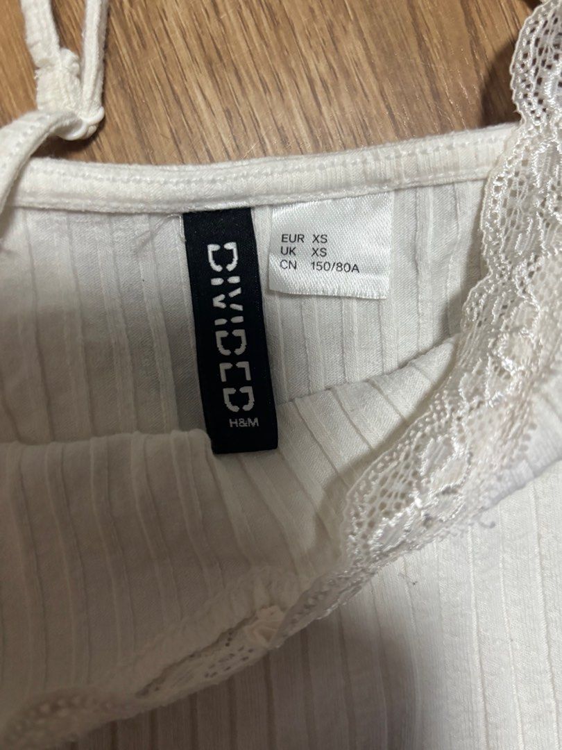 Take all white tank tops (Category: Sleeveless) located in Quezon City. Submitted by declutterbynini (Listing ID 1401872334, Image 3). Description: Zara and H&M tank tops Very cute and sexy to wear! No flaws.