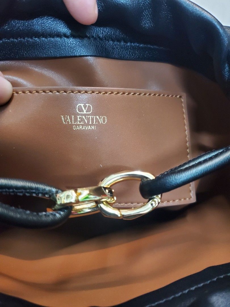 Valentino Garavani Drawstring Crossbody Bag (Category: Luxury Bags & Wallets) located in Manila. Submitted by mavel0817 (Listing ID 1401755893, Image 3). Description: Valentino Garavani drawstring Genuine Leather etikita.