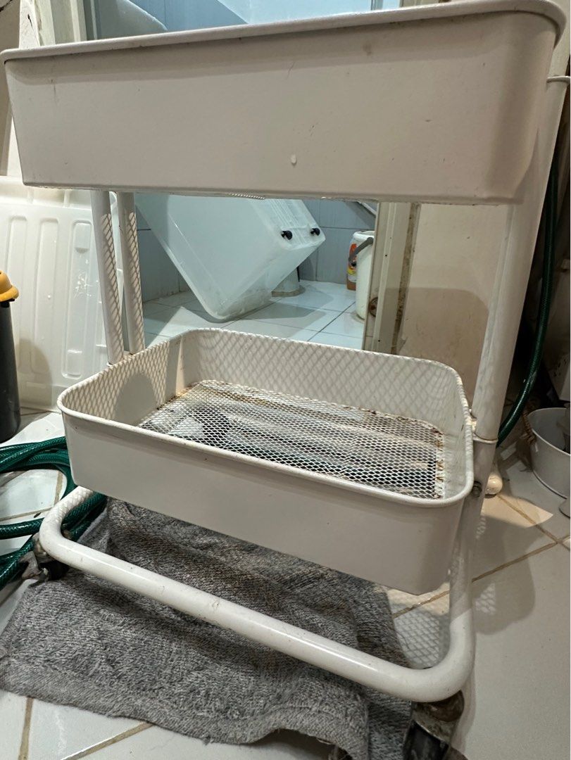 White 2-Tier Rolling steel Cart (Category: Shelves, Cabinets & Racks) located in Caloocan City. Submitted by trisssh0 (Listing ID 1401880071, Image 2). Description: 3tier pero nawala na yung stand pang 3rd tier.