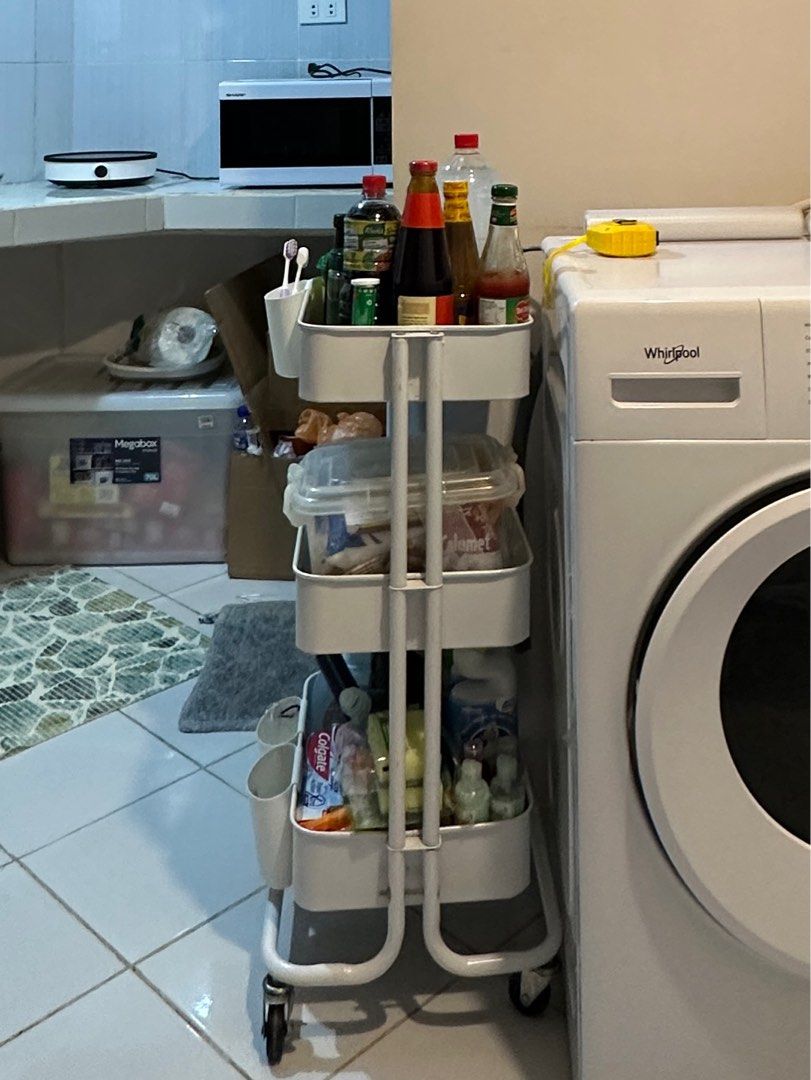 White 2-Tier Rolling steel Cart (Category: Shelves, Cabinets & Racks) located in Caloocan City. Submitted by trisssh0 (Listing ID 1401880071, Image 1). Description: 3tier pero nawala na yung stand pang 3rd tier.