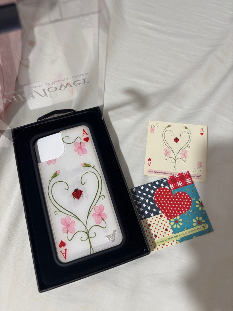 Wildflower IPhone 13/14 Case x Lily Moss (Category: Cases & Sleeves) located in Manila. Submitted by sabinayu (Listing ID 1401894919, Image 2). Description: 🏷️ WF X LILY MOSS IPhone 13/14 ₱2,500 ❤️ Alabang Location 😊 RFS : Wrong Size.