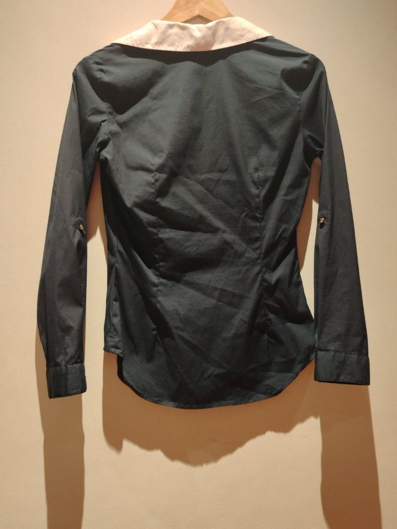 Zara Basic Long Sleeve Blouse (Category: Blouses) located in Pasig City. Submitted by vthing (Listing ID 1401864414, Image 3). Description: - Zara Basic long sleeve blouse - Features a classic white collar - Dark-colored fabric - Button-down front - Includes a small chest pocket - Made in Spain - Size: EUR S, MEX 26, USA S.