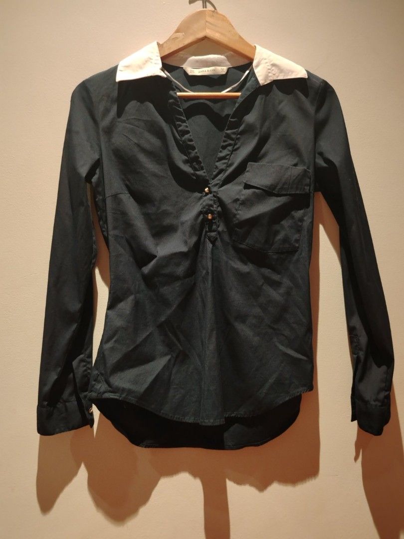Zara Basic Long Sleeve Blouse (Category: Blouses) located in Pasig City. Submitted by vthing (Listing ID 1401864414, Image 1). Description: - Zara Basic long sleeve blouse - Features a classic white collar - Dark-colored fabric - Button-down front - Includes a small chest pocket - Made in Spain - Size: EUR S, MEX 26, USA S.