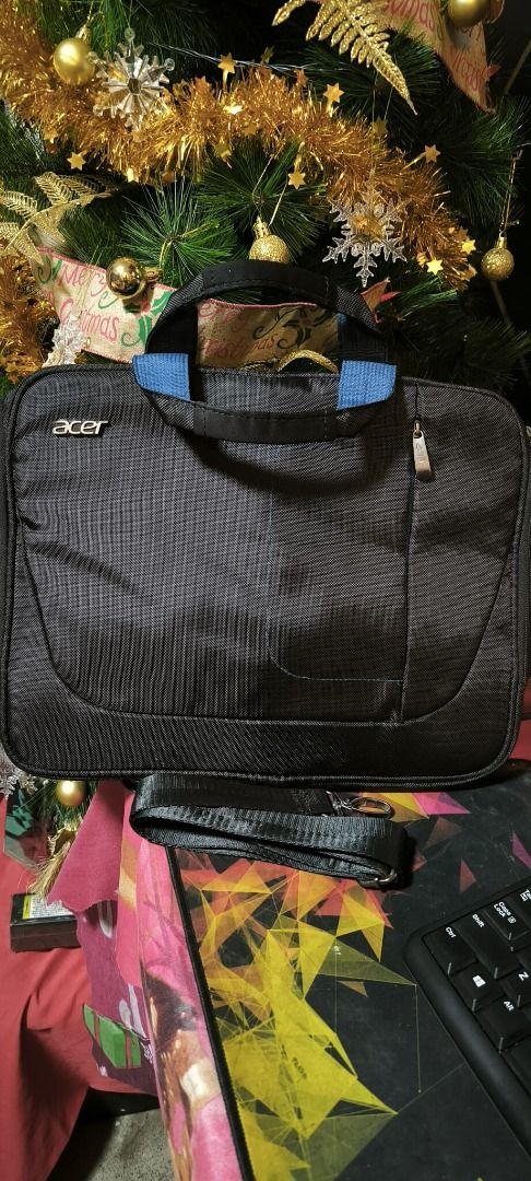 ACER Laptop Bag with Sling (Category: Laptop Bags & Sleeves) located in Manila. Submitted by Ms.Joycee (Listing ID 1405317681, Image 1). Description: Approx measurement: -Height: 12 inches -Width: 16 inches Minor rust on the side hardware at the sling-strap attachment (see last two photos)..