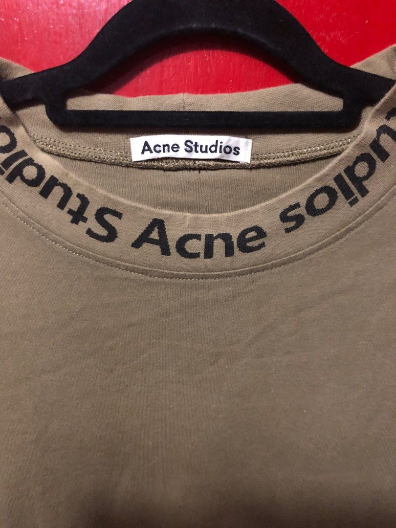 Acne Studios Logo T-shirt (Category: Tshirts & Polo Shirts ) located in Bacoor. Submitted by well_curated (Listing ID 1405241503, Image 2). Description: - Acne Studios T-shirt - Features a logo print on the collar - Solid color - Standard fit - Soft and comfortable fabric - Brand tag visible -no wash tags.