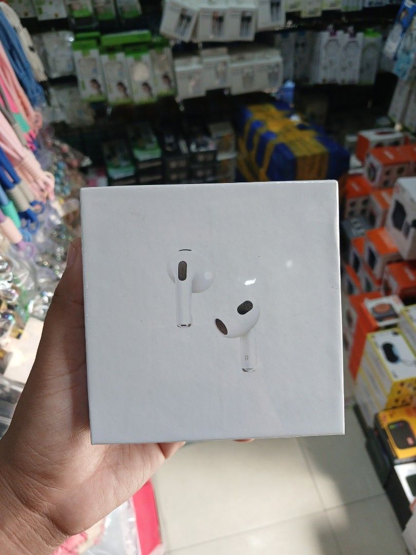 AirPods Gen 3with MagSafe Charging Case (Category: Earphones) located in Manila. Submitted by nhh_accessories (Listing ID 1405231476, Image 1). Description: - Apple AirPods with MagSafe Charging Case - Includes AirPods and charging case - Color: White - Box features: - AirPods design - Charging case - Apple logo - Product information.