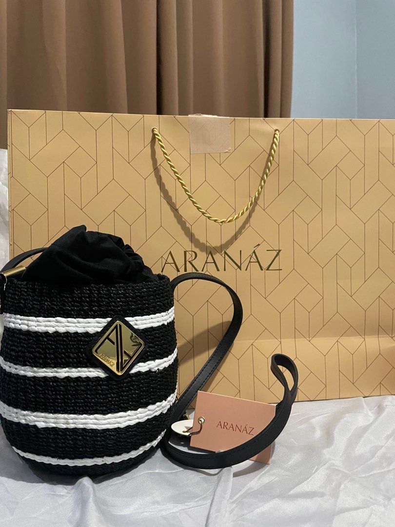 Aranaz Carrie (Category: Luxury Bags & Wallets) located in Manila. Submitted by holakarenzki (Listing ID 1405280397, Image 2). Description: Open for Swap Please show me your item - Aranaz bucket bag - Black and white striped design - Drawstring closure - Detachable shoulder strap - Includes dust bag - Includes shopping bag - Aranaz logo visible - Authentic Filipino design.