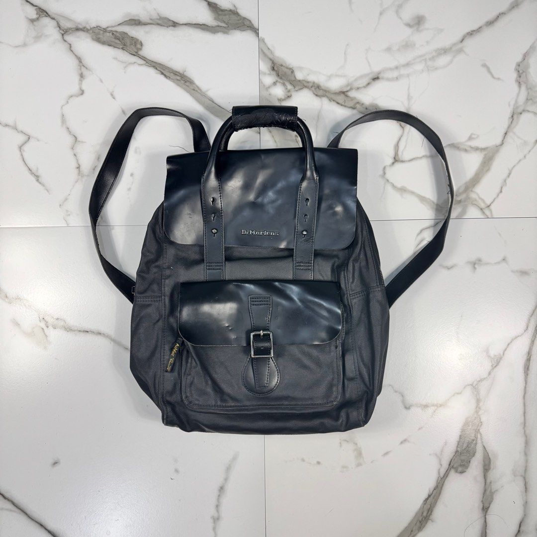 Dr. Marten’s - Kiev Smooth Leather & Canvas - Backpack (Category: Backpacks) located in Dasmarinas. Submitted by F_A_Q (Listing ID 1405287777, Image 1). Description: ONE SIZE - 16 In. Width - 18 In. Length 9/10 Overall usage Note : Minor/unnoticeable leather peeling due to age and usage. Still very mint condition. .