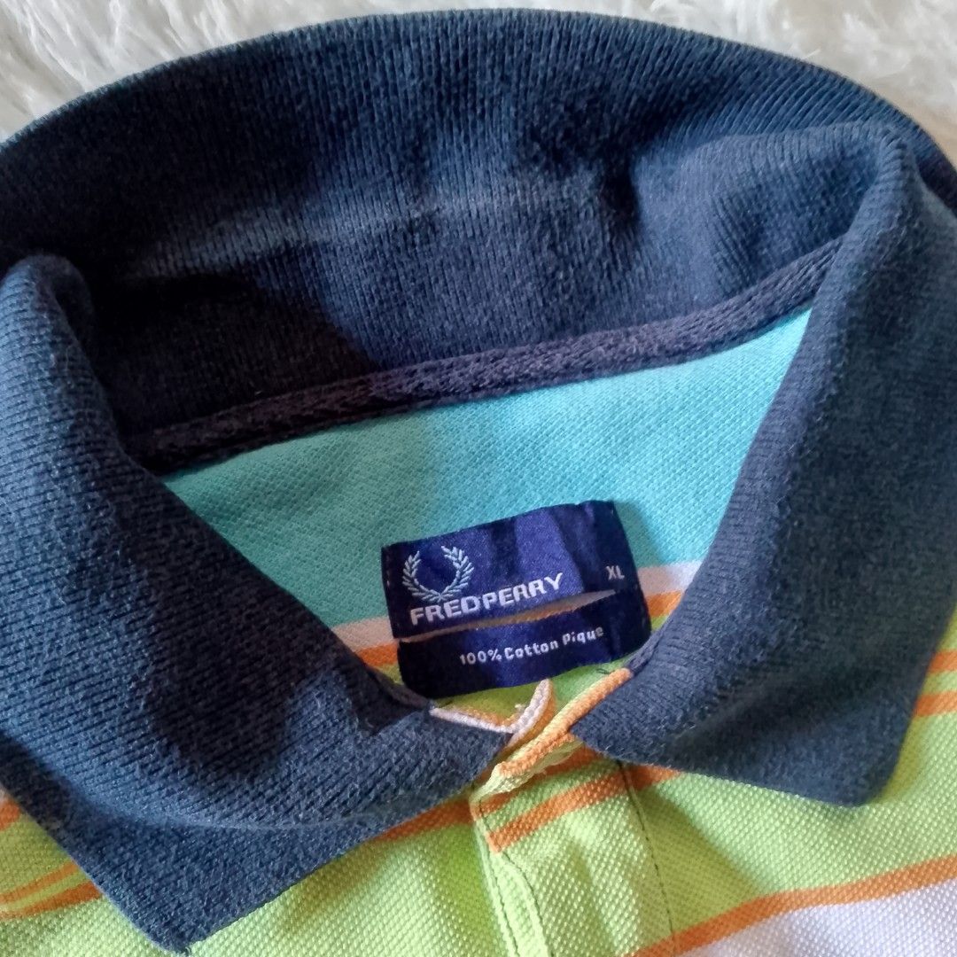 Fredperry Polo shirt with stripe (Category: Shirts) located in Davao. Submitted by lee_ly (Listing ID 1405224564, Image 3). Description: Lightly used xl on tag with minimal collar line.