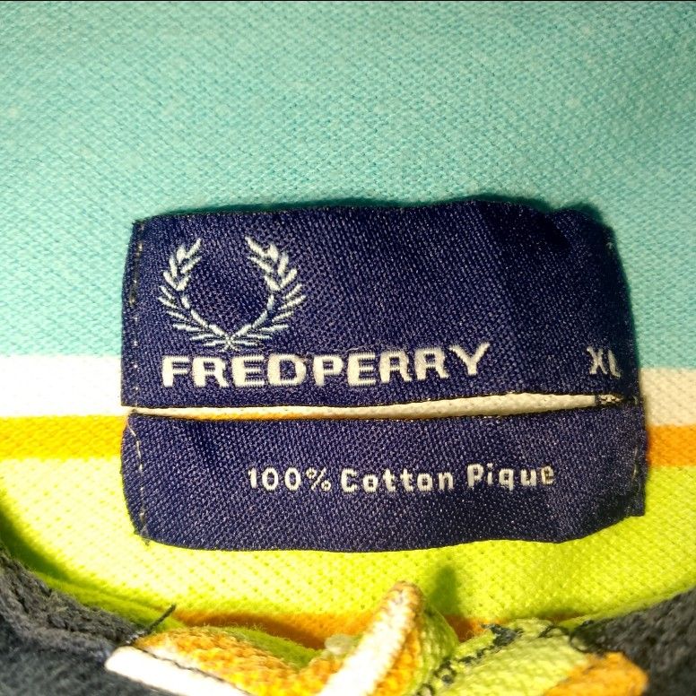 Fredperry Polo shirt with stripe (Category: Shirts) located in Davao. Submitted by lee_ly (Listing ID 1405224564, Image 2). Description: Lightly used xl on tag with minimal collar line.