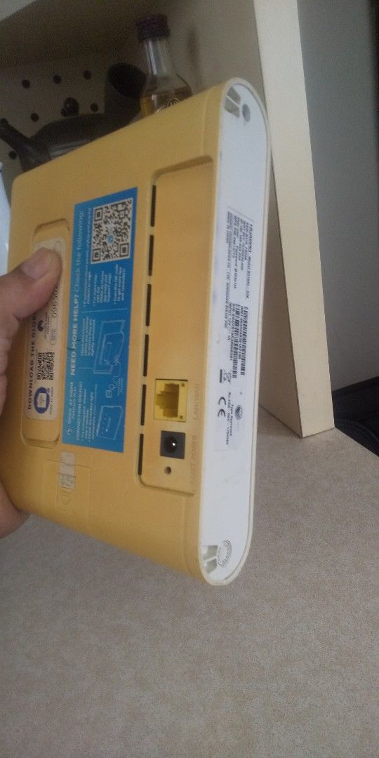 Globe At Home Prepaid WiFi Router (unit only) (Category: Networking) located in Carmona. Submitted by rpute (Listing ID 1405232452, Image 2). Description: - Globe At Home Prepaid WiFi router - Features: - Power button - Signal indicators - Globe logo - Ports: - Yellow Ethernet port - Power input - Includes a QR code for easy setup - Color: Yellow and White.
