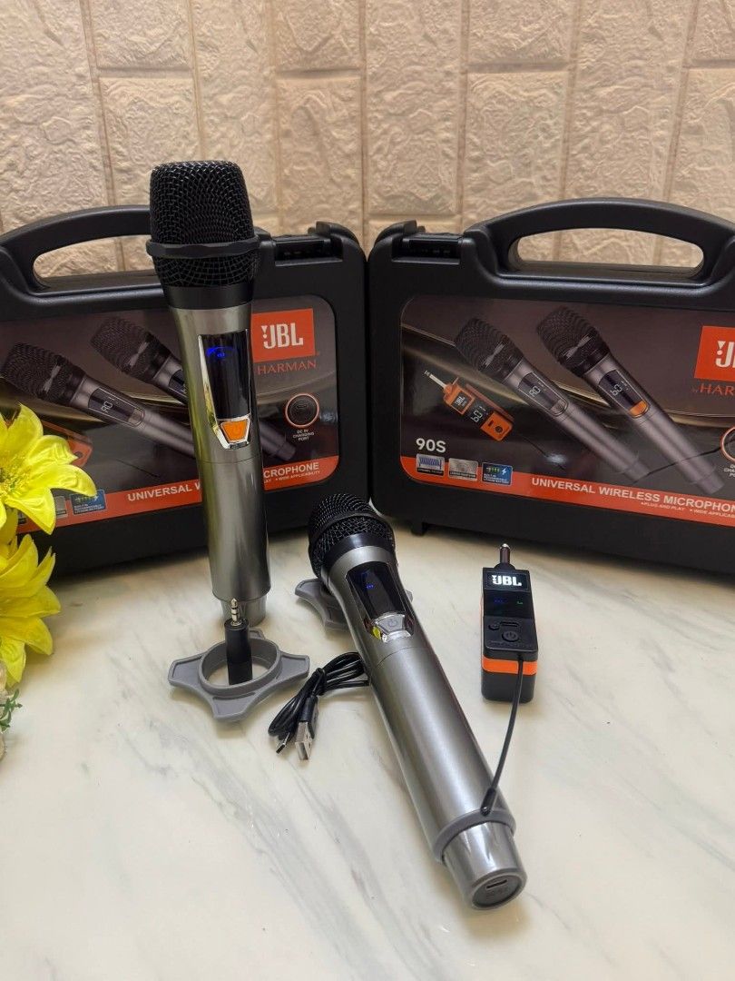 JBL 90S Universal Wireless Microphone (Category: Microphones) located in Manila. Submitted by iliasjen3082126 (Listing ID 1405333345, Image 3). Description: JBL 90S universal wireless microphone set includes two microphones, a receiver, charging cable, and accessories. It comes in a hard carrying case for easy storage and transport. The microphones have an LCD screen and a DC-5V charging port. The set also includes batteries and microphone stands
