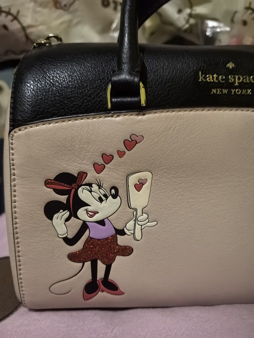 Kate Spade x Disney sling bag (Category: Luxury Bags & Wallets) located in Quezon City. Submitted by uptrendglam (Listing ID 1405298183, Image 2). Description: Kate Spade collab with Disney sling bag with removable strap inclusions are care card and Hangtag. Guaranteed authentic with Kate Spade paperbag for gifting. Please refrain for offering insulting discount up to 70 to 80% off. I would rather have this keep for my collection than to accept s