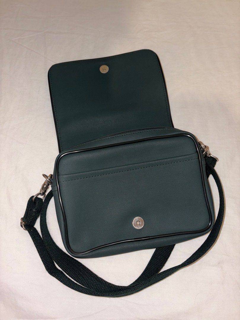 Lacoste Dark Green Bag (Category: Cross-body Bags) located in Paranaque City. Submitted by izzysus (Listing ID 1405281646, Image 3). Description: - excellent condi - DARK GREEN - no marks, leather tears and noticeable marks - rfs: decluttering mop: gcash/maya.