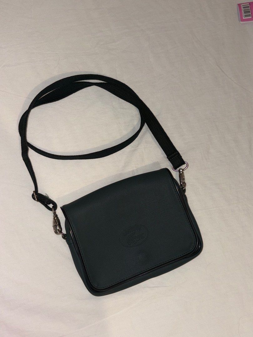 Lacoste Dark Green Bag (Category: Cross-body Bags) located in Paranaque City. Submitted by izzysus (Listing ID 1405281646, Image 1). Description: - excellent condi - DARK GREEN - no marks, leather tears and noticeable marks - rfs: decluttering mop: gcash/maya.