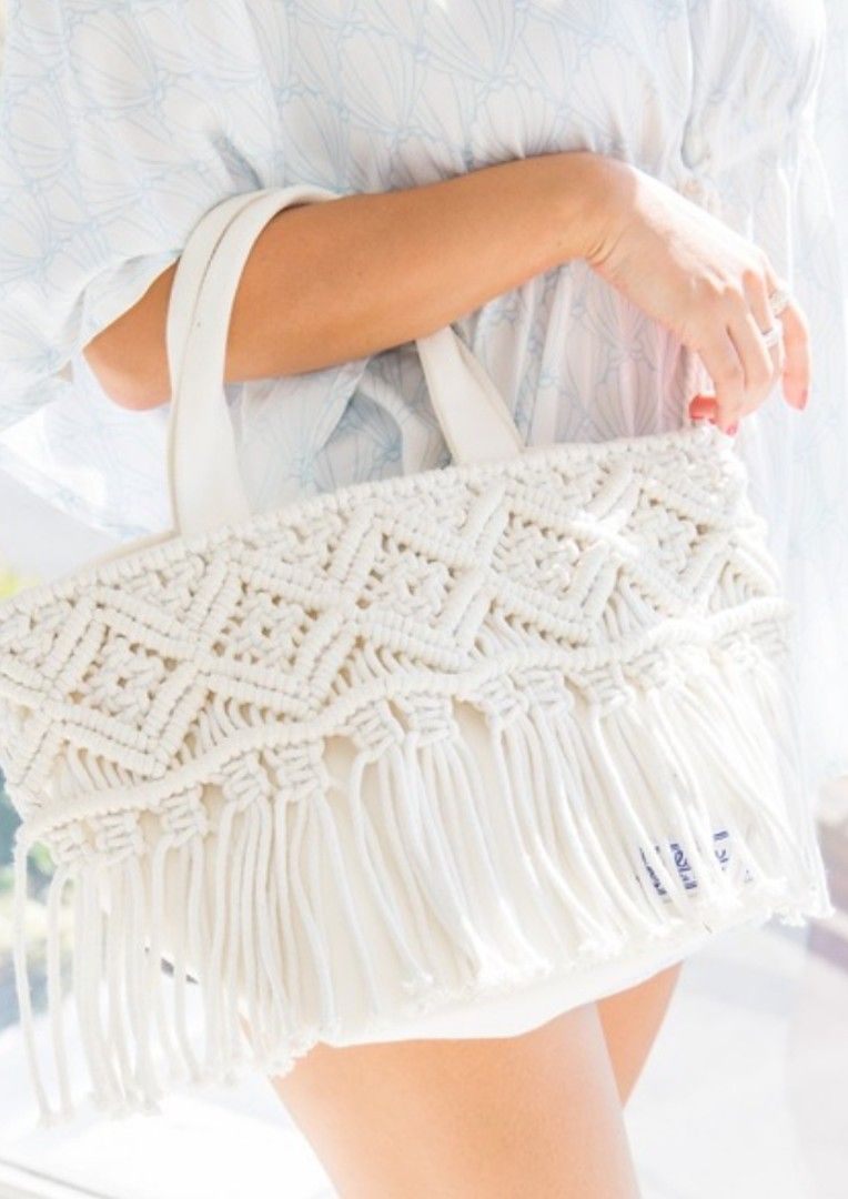 Macrame Fringe Handbag (Category: Shoulder Bags) located in Antipolo. Submitted by thethriftmarket (Listing ID 1405227025, Image 1). Description: Bayflow bag from Japan - Unique macrame design with fringe - Sturdy handles - Spacious interior - Inner pocket for organization - Magnetic snap closure - Versatile neutral color.