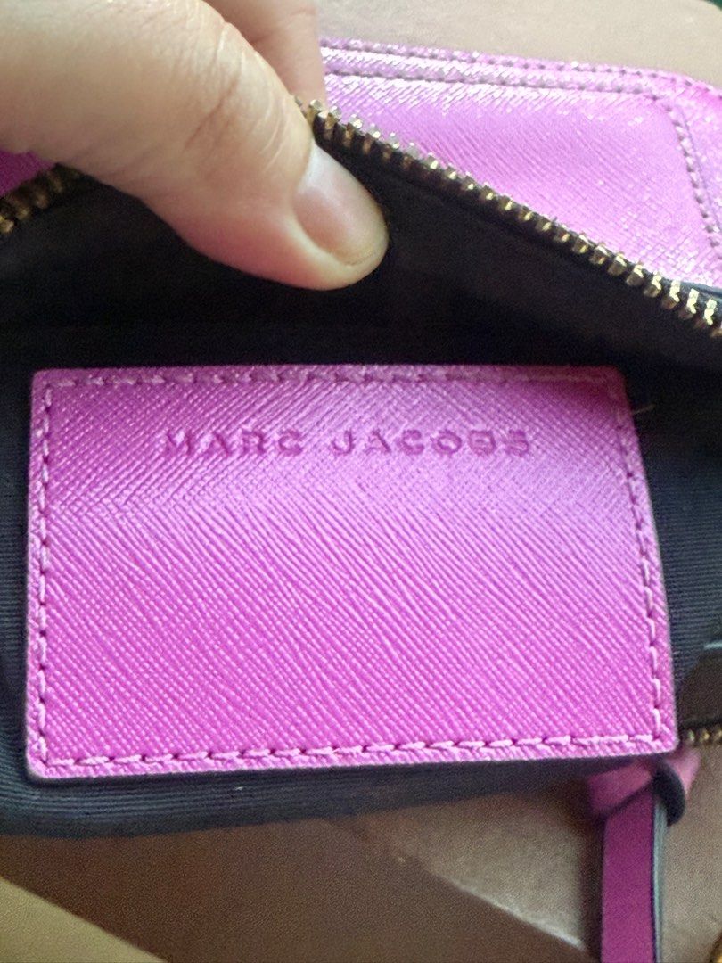 Marc Jacobs The Box Bag in PURPLE (Category: Luxury Bags & Wallets) located in Paranaque City. Submitted by lyn0618 (Listing ID 1405260566, Image 3). Description: FOR SALE. AUTHENTIC MARC JACOBS camera /box bag in PURPLE. Personal PRE LOVED. Used not Abused. GOLD HARDWARES Marc Jacobs ENGRAVED YKK ZIPPER. See pictures for transparency of its AUTHENTICITY. All gold hardwares engraved with MARC JACOBS 2 Compartments can fit IPHONE 17 Or 16 pro max 