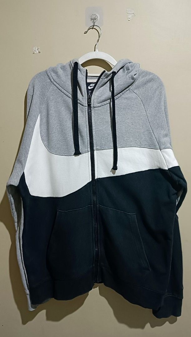 Nike Swoosh Tracksuit Set - Gray (Category: Sets & Coordinates) located in Manila. Submitted by markdennis72579 (Listing ID 1405232959, Image 2). Description: - Nike tracksuit set - Color scheme: Gray, white, and black - Includes: Full-zip hoodie and joggers - Features: Nike swoosh design and logo - Jacket size: L - Pants size: L.
