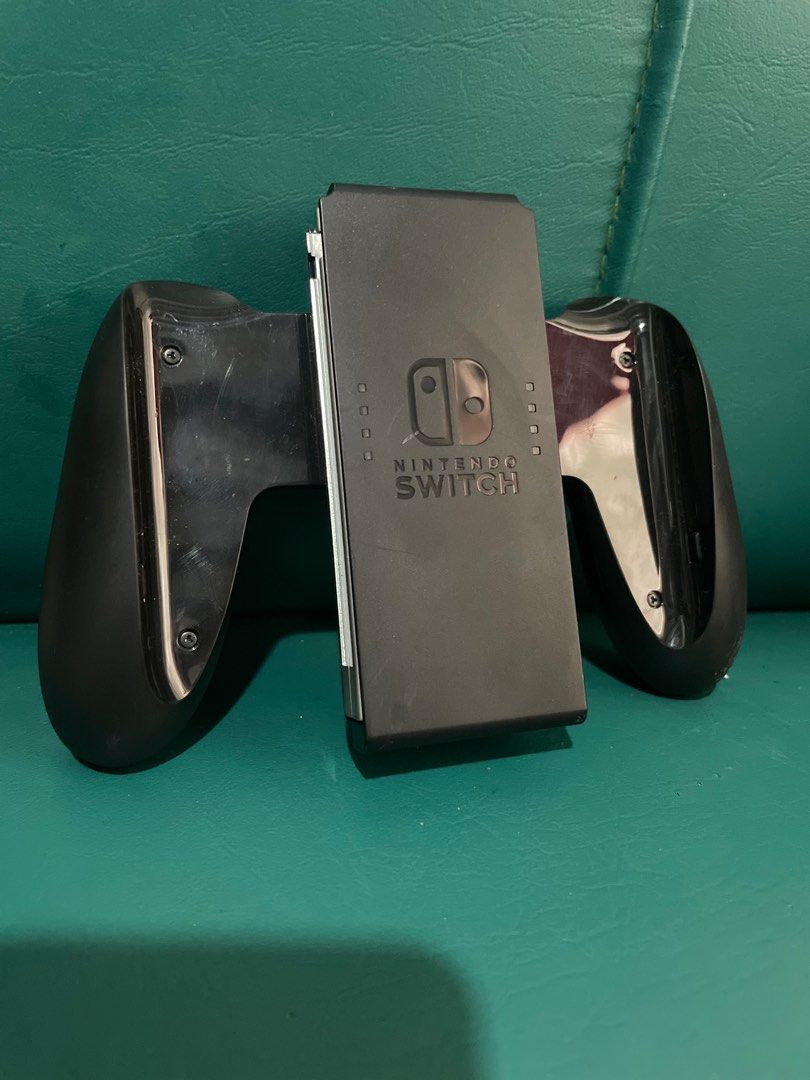 Nintendo Switch Joycon Grip (Category: Controllers) located in Naic. Submitted by avin_pamplina (Listing ID 1405212891, Image 1). Description: Sf care of buyer Shipment via J&T. As seen on pics.