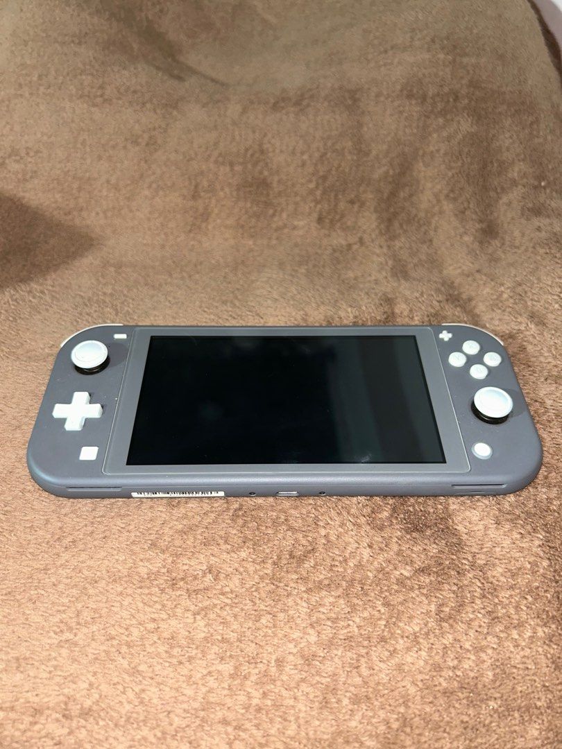 Nintendo Switch Lite with Games (read description) (Category: Nintendo) located in Dasmarinas. Submitted by docaya (Listing ID 1405311491, Image 3). Description: FS: Nintendo Switch Lite (Gray) – For Decluttering Inclusions: • Free protective case • Free thumb grips • Original charger included • Console only: ₱8,000 Games (sold separately): • Animal Crossing: ₱1,800 • Mario Kart 8 Deluxe: ₱1,800 • Hogwarts Legacy: ₱1,600 Promo Bundle: Get the con