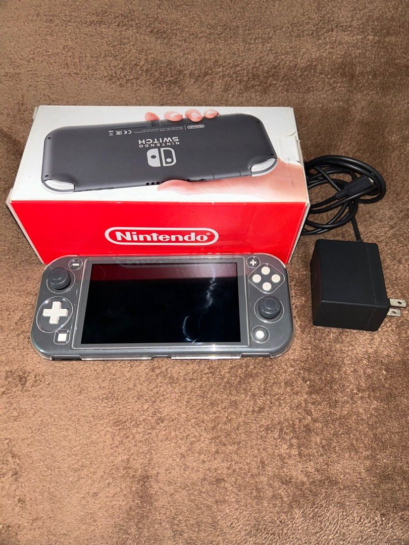 Nintendo Switch Lite with Games (read description) (Category: Nintendo) located in Dasmarinas. Submitted by docaya (Listing ID 1405311491, Image 2). Description: FS: Nintendo Switch Lite (Gray) – For Decluttering Inclusions: • Free protective case • Free thumb grips • Original charger included • Console only: ₱8,000 Games (sold separately): • Animal Crossing: ₱1,800 • Mario Kart 8 Deluxe: ₱1,800 • Hogwarts Legacy: ₱1,600 Promo Bundle: Get the con