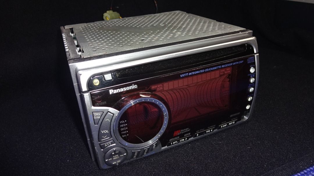 Panasonic VX777 Integrated CD/Cassette Receivers with DSP (Category: Other Audio Equipment) located in Paranaque City. Submitted by kutoi.ancheta (Listing ID 1405319170, Image 3). Description: Car Audio Receiver/Head Unit. The item is an in-dash stereo component, not a publication. TITLE: Panasonic VX777 Integrated CD/Cassette Receiver with DSP. The rear label indicates a model number CQ-VX777C. PRODUCTION YEAR: Unconfirmed. Based on the model ty