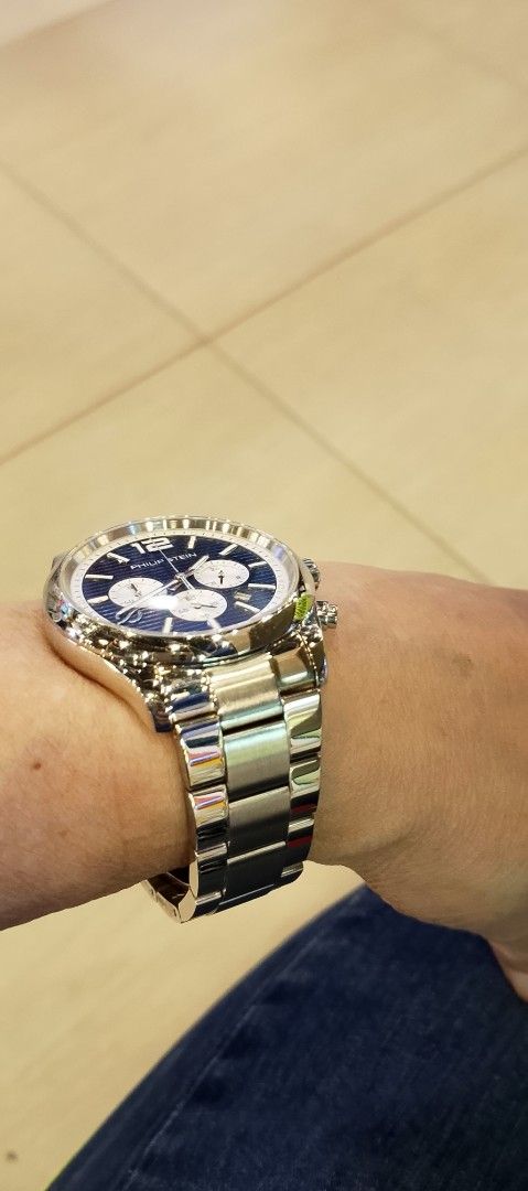 Philip Stein Chronograph Watch (Category: Luxury Watches) located in Quezon City. Submitted by expe888 (Listing ID 1405326679, Image 3). Description: Philip Stein watch 42mm. quartz movement. all stainless steel band and a blue dial with white sub-dials. It has a chronograph function and a date display. The watch has a butterfly clasp. The watch is shown on a wrist, indicating a comfortable fit. no extra links. pm if Interested.