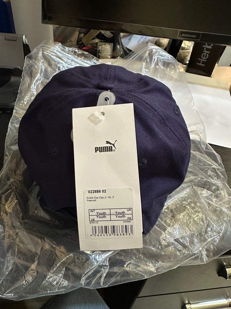 Puma Youth Cap (Category: Babies & Kids Fashion) located in Iloilo. Submitted by isteb (Listing ID 1405214297, Image 2). Description: - Navy blue Puma cap for youth. - Features Puma logo. - Youth size. - Brand new, still in original packaging. Bought the wrong size.