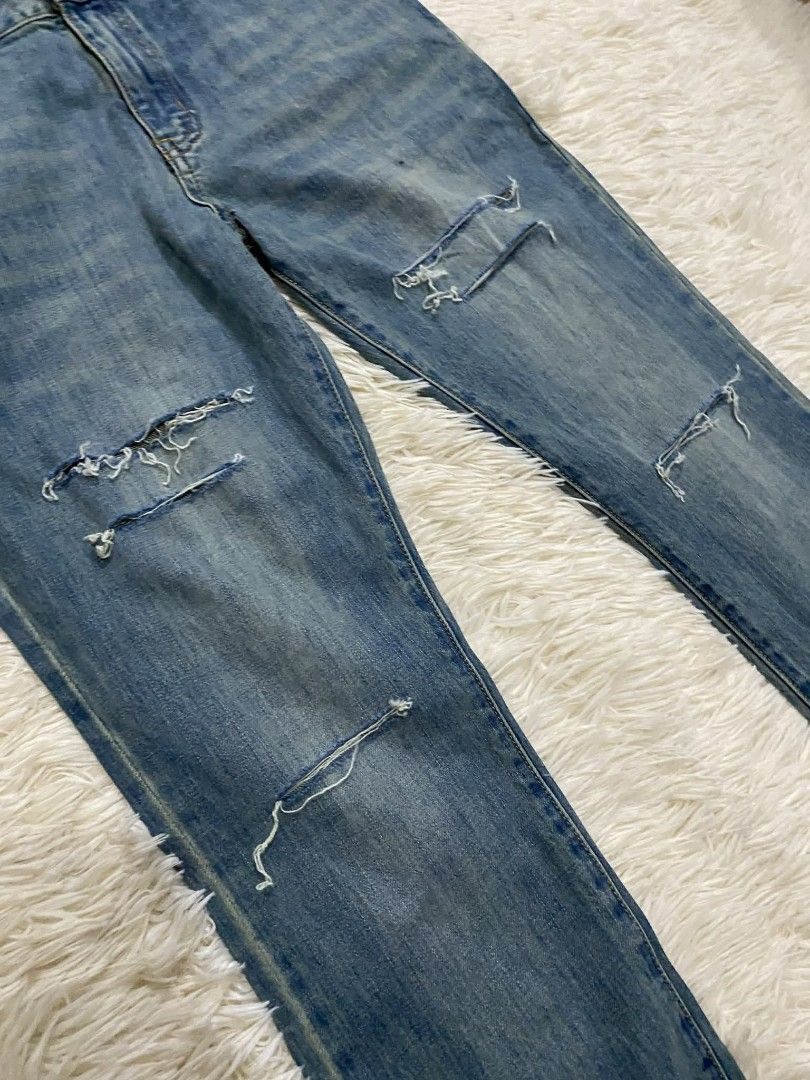 Saint Laurent Distressed Jeans (Category: Luxury Apparel) located in Manila. Submitted by switchcity (Listing ID 1405344562, Image 2). Description: - Saint Laurent Paris jeans - Distressed details - Light wash denim - Slim fit -SIZE 34 - Classic five-pocket design - Button closure with Saint Laurent Paris logo - Size: 002 M/SK/LW.