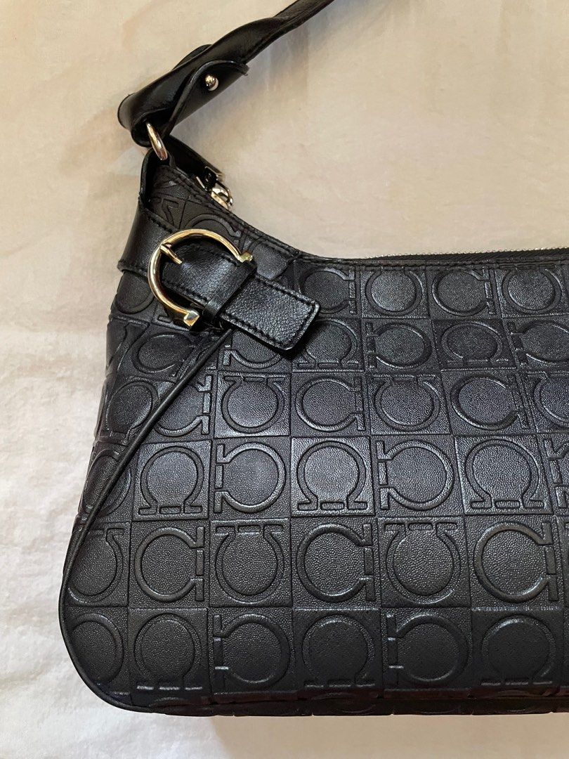Salvatore Ferragamo Black Shoulder Bag (Category: Luxury Bags & Wallets) located in Paranaque City. Submitted by riceywicey (Listing ID 1405217892, Image 3). Description: Salvatore Ferragamo shoulder bag - Authentic - Repeating logo pattern - Zip closure - Shoulder strap - Silver-tone hardware - Includes dust bag.