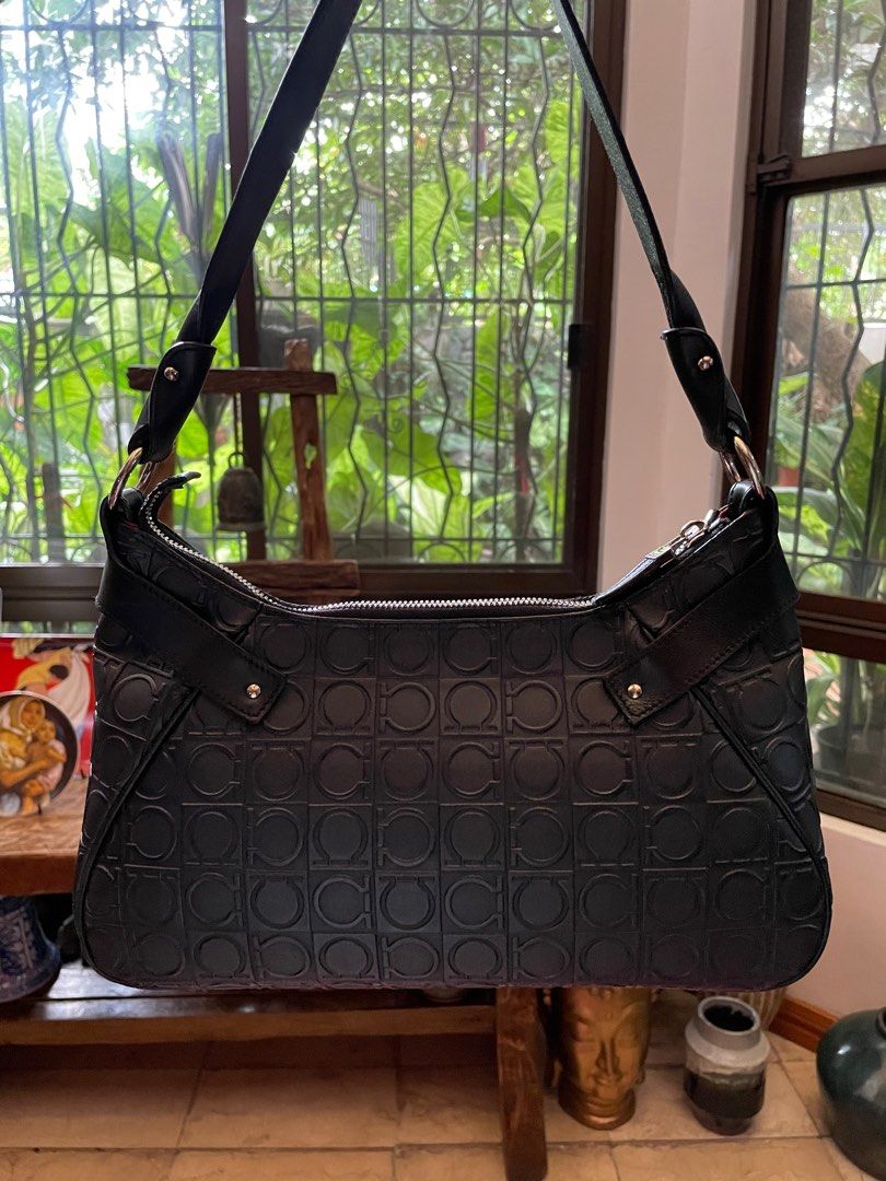 Salvatore Ferragamo Black Shoulder Bag (Category: Luxury Bags & Wallets) located in Paranaque City. Submitted by riceywicey (Listing ID 1405217892, Image 2). Description: Salvatore Ferragamo shoulder bag - Authentic - Repeating logo pattern - Zip closure - Shoulder strap - Silver-tone hardware - Includes dust bag.