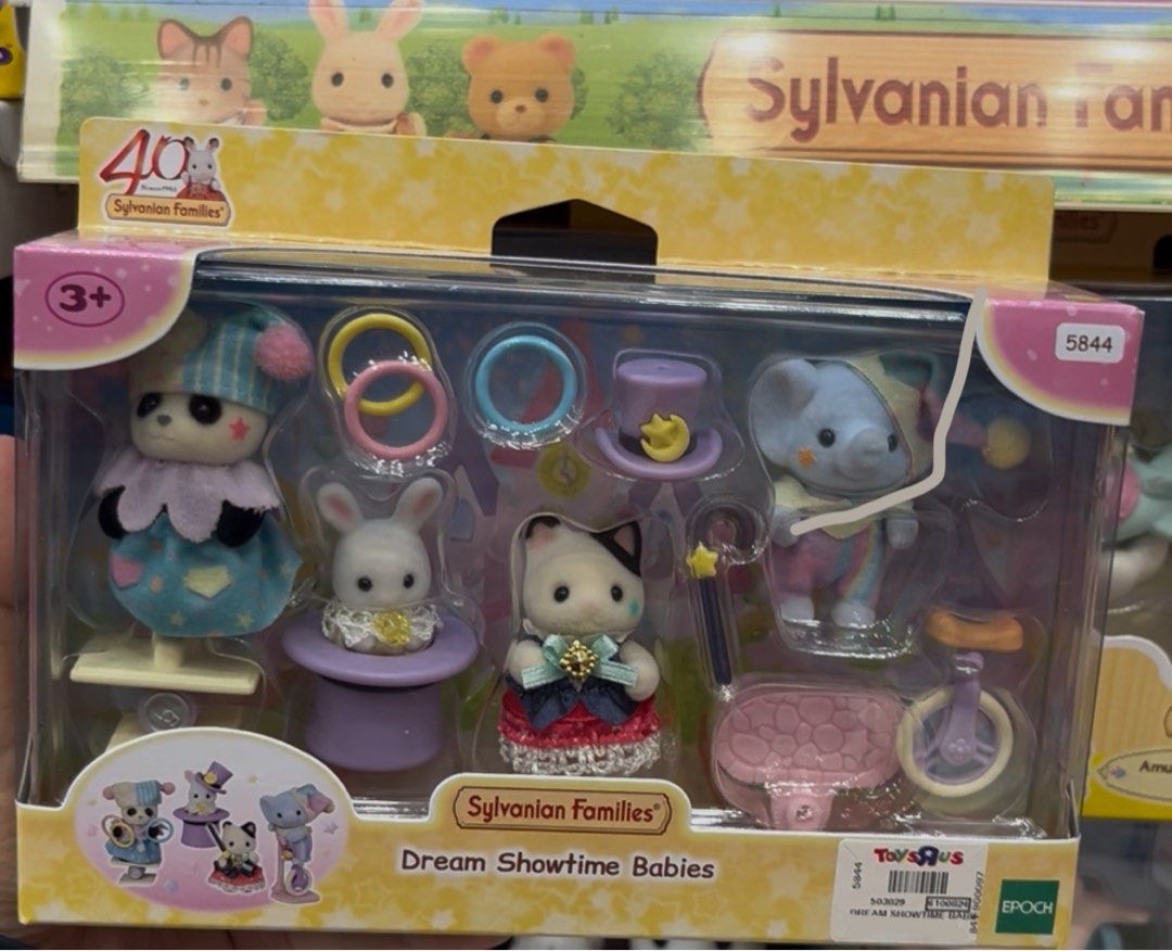 Sylvanian Families Dream Showtime Babies (Category: Kids Toys) located in Quezon City. Submitted by anikanikgirly (Listing ID 1405246104, Image 1). Description: - Sylvanian Families Dream Showtime Babies set. - Features adorable animal figures: panda, rabbit, cat, and elephant. - Dressed in charming circus-themed outfits. - Includes fun accessories: rings, magic wand, and unicycle. - Ideal addition to any Sylvanian Families collection. - Encourag