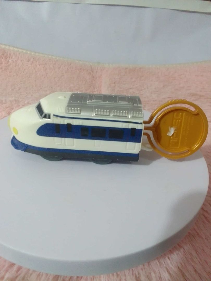 Toy Train Assortment Take all (Category: Vehicle & Diecast Models) located in Tanza. Submitted by leonskidskorner (Listing ID 1405276233, Image 1). Description: Collection of toy trains in various colors and designs. Includes a black train, a green train, a red train, and several bullet train models. Some trains have pull-back mechanisms. Great for kids who love trains or collectors..