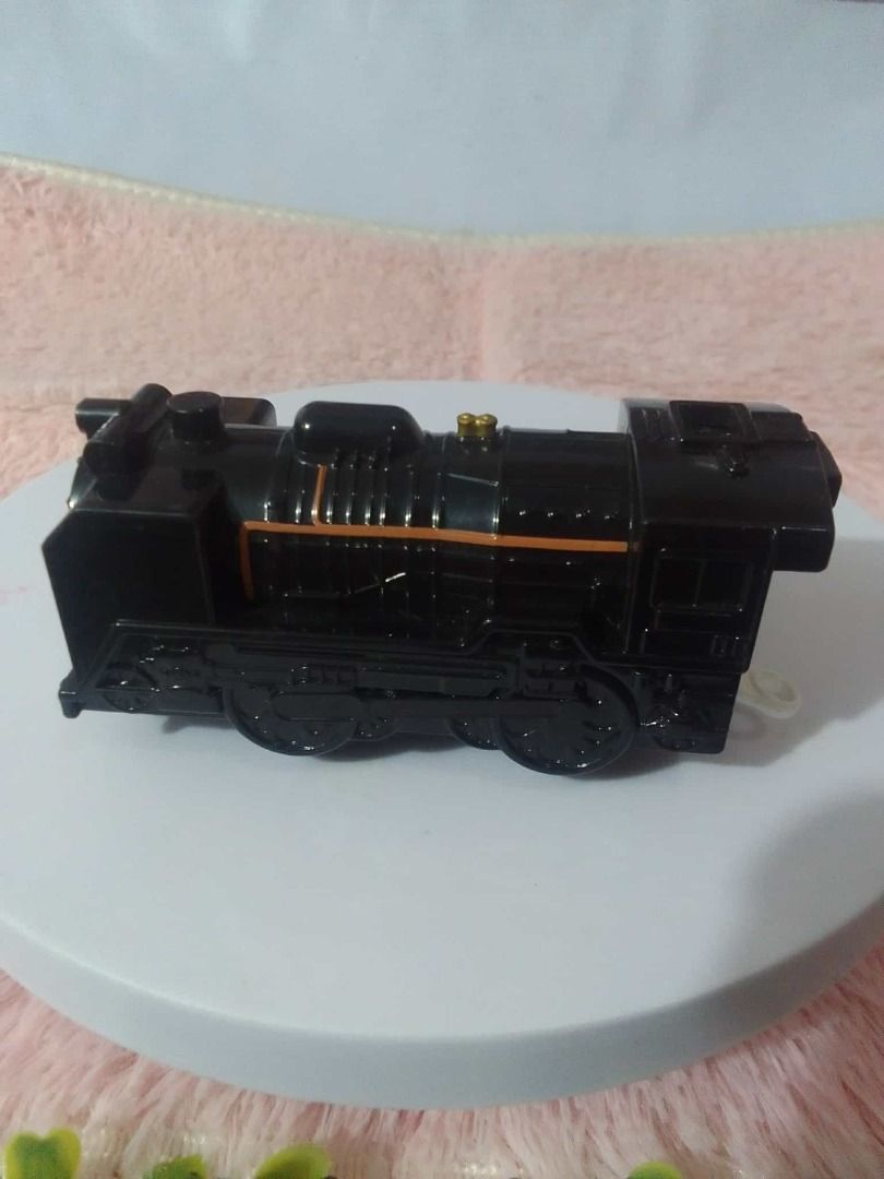 Toy Train Assortment Take all (Category: Vehicle & Diecast Models) located in Tanza. Submitted by leonskidskorner (Listing ID 1405276233, Image 2). Description: Collection of toy trains in various colors and designs. Includes a black train, a green train, a red train, and several bullet train models. Some trains have pull-back mechanisms. Great for kids who love trains or collectors..