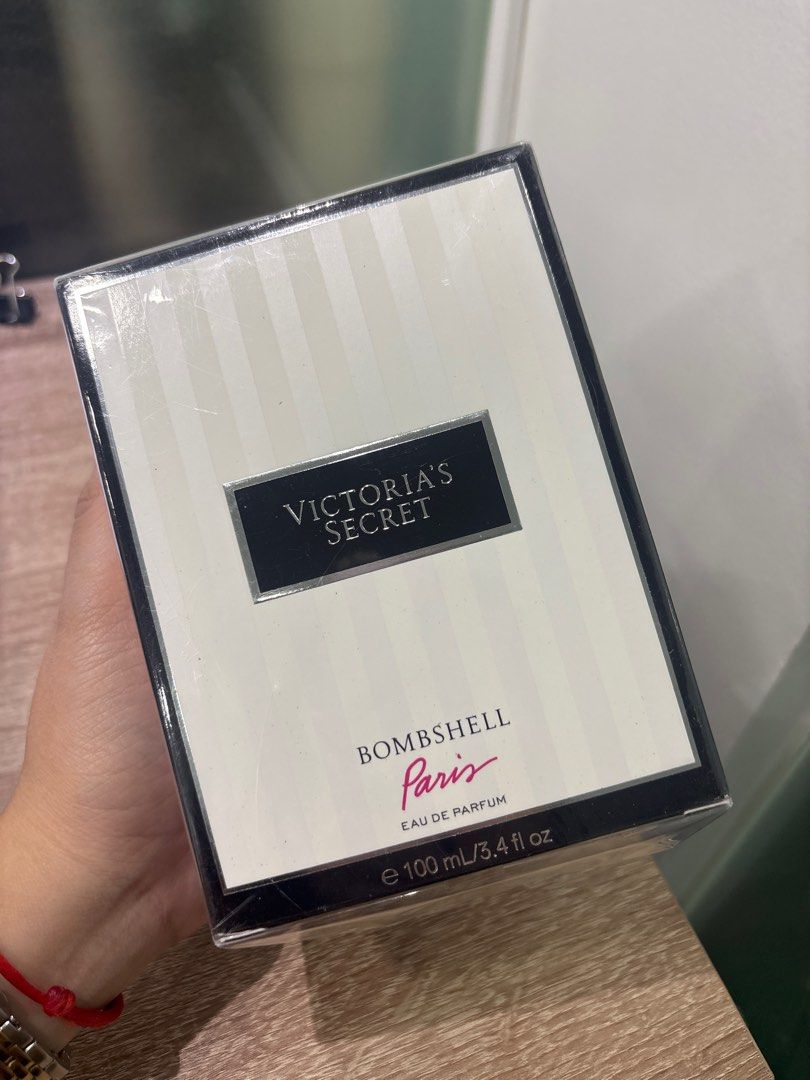 Victoria's Secret Bombshell Paris Eau de Parfum (Category: Fragrance & Deodorants) located in Paranaque City. Submitted by massieblck (Listing ID 1405177465, Image 1). Description: - Sprayed 3x only - Victoria's Secret Bombshell Paris Eau de Parfum - 100 mL / 3.4 fl oz bottle - New and sealed - Features a black and white striped box.