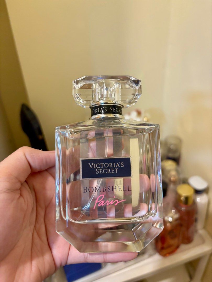 Victoria's Secret Bombshell Paris Eau de Parfum (Category: Fragrance & Deodorants) located in Paranaque City. Submitted by massieblck (Listing ID 1405177465, Image 2). Description: - Sprayed 3x only - Victoria's Secret Bombshell Paris Eau de Parfum - 100 mL / 3.4 fl oz bottle - New and sealed - Features a black and white striped box.