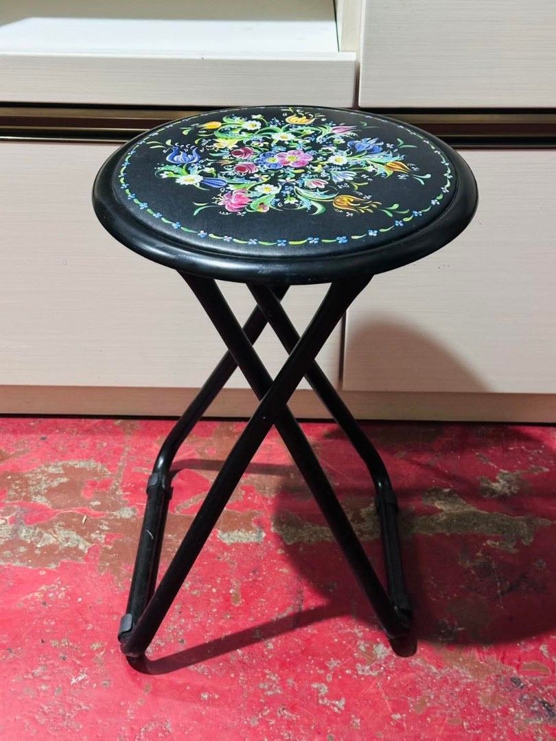 Vintage Floral Design Folding Stool (Category: Chairs) located in Imus. Submitted by umusthave23 (Listing ID 1405327468, Image 3). Description: Round Folding Stool Like new Dia. 12.5in x H18in Folding stool with a vibrant floral design - Round seat with colorful flowers on a black background - Sturdy black metal frame - Folds flat for convenient storage - Ideal for both indoor and outdoor settings.