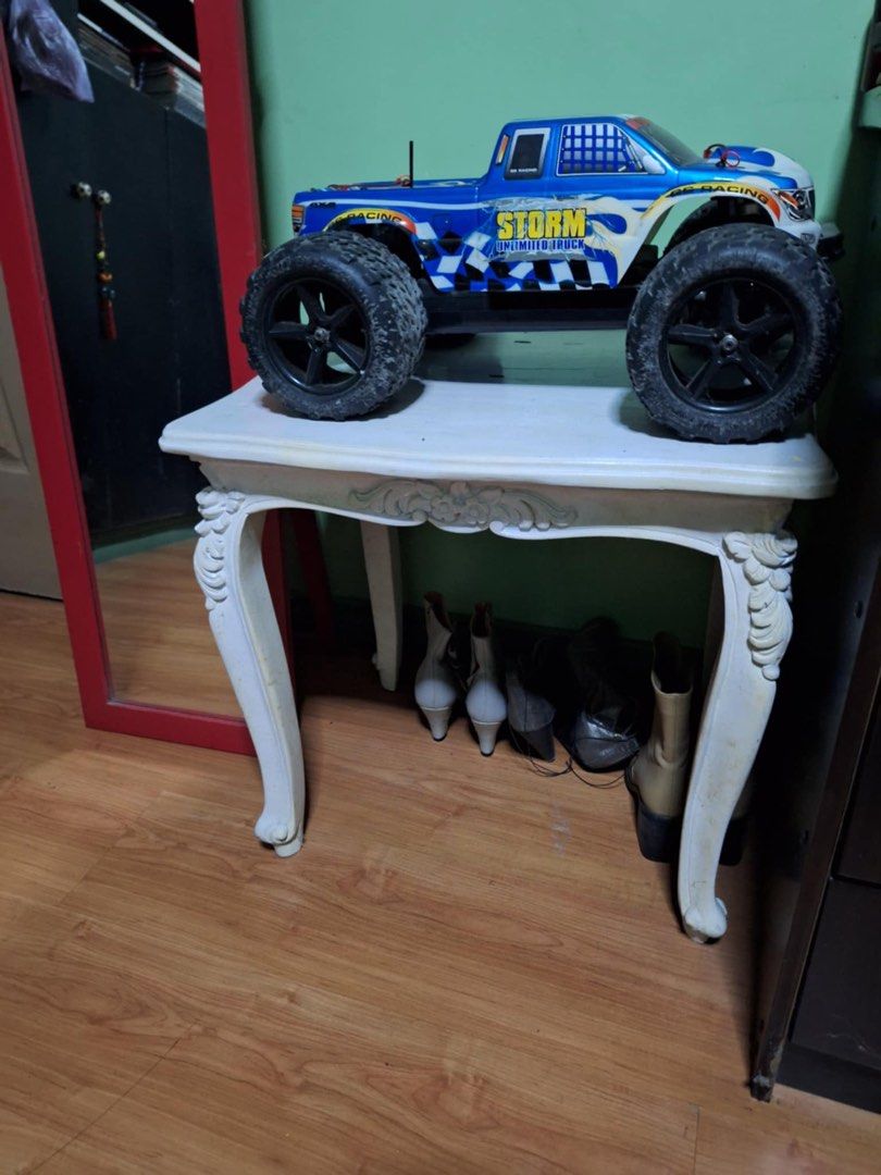 Vintage White Side Table (Category: Tables & Sets) located in Manila. Submitted by munggomooo (Listing ID 1405253372, Image 2). Description: Elegant white side table. Features ornate detailing, curved legs, and a decorative apron. Perfect for display and storage. Adds vintage charm..