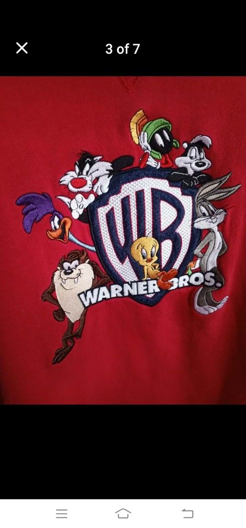Warner Bros. Looney Tunes Sweatshirt (Category: Coats, Jackets and Outerwear) located in Mandaluyong City. Submitted by ireneipt_21 (Listing ID 1405246918, Image 2). Description: - Looney Tunes sweatshirt - Features Bugs Bunny, Daffy Duck, Sylvester, Tweety, and Taz - Crew neck - Long sleeves - Fleece-lined interior - Tag is visible.