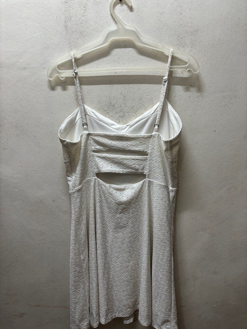 White Eyelet Dress with Cutout Back (Category: Dresses) located in Paranaque City. Submitted by cathsudon (Listing ID 1405170336, Image 2). Description: White Eyelet Dress > A fave! Perfect for dates, sunny events, and brunches > Adjustable spaghetti straps, V-neckline, Cutout back detail > Fitted bodice with flared skirt. Very flattering. > Message for WW > RFS: Decluttering > Price is negotiable MOP: GCash/BPI via QR (will be provided once I ac