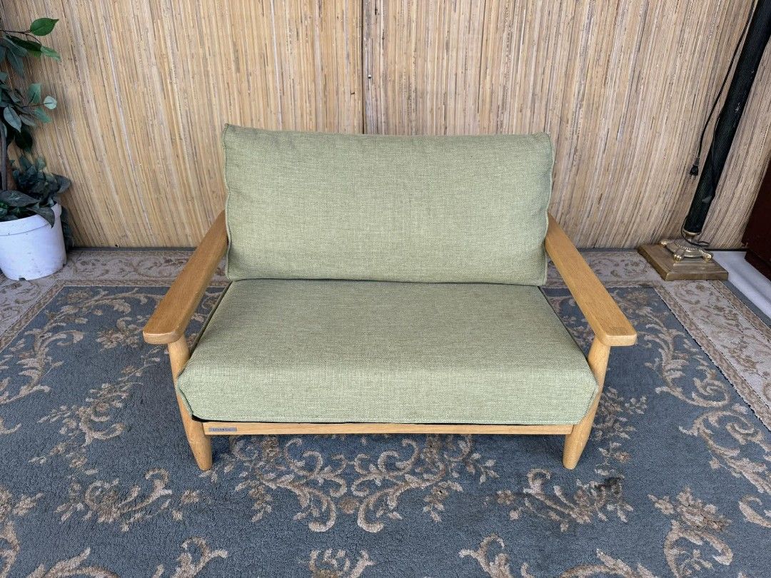 Wooden Frame Sofa with Green Cushions (Category: Sofas) located in Manila. Submitted by eloizavill76462 (Listing ID 1405340504, Image 1). Description: Livart Kids Sofa 2-Seater / Solid Wood Frame L31.5 x W23 x H22/11 In good condition .