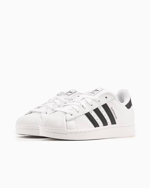 Adidas Superstar White Black Sneakers (Category: Sneakers) located in Pasig City. Submitted by Great_Finds (Listing ID 1405500204, Image 3). Description: - Adidas Superstar sneakers - White with black stripes - Iconic shell toe - Adidas branding on tongue and heel - "SUPERSTAR" printed on side - Clean white sole with black accents - Laced up - US size 11 UK size 10.5 - SRP = P5,500.
