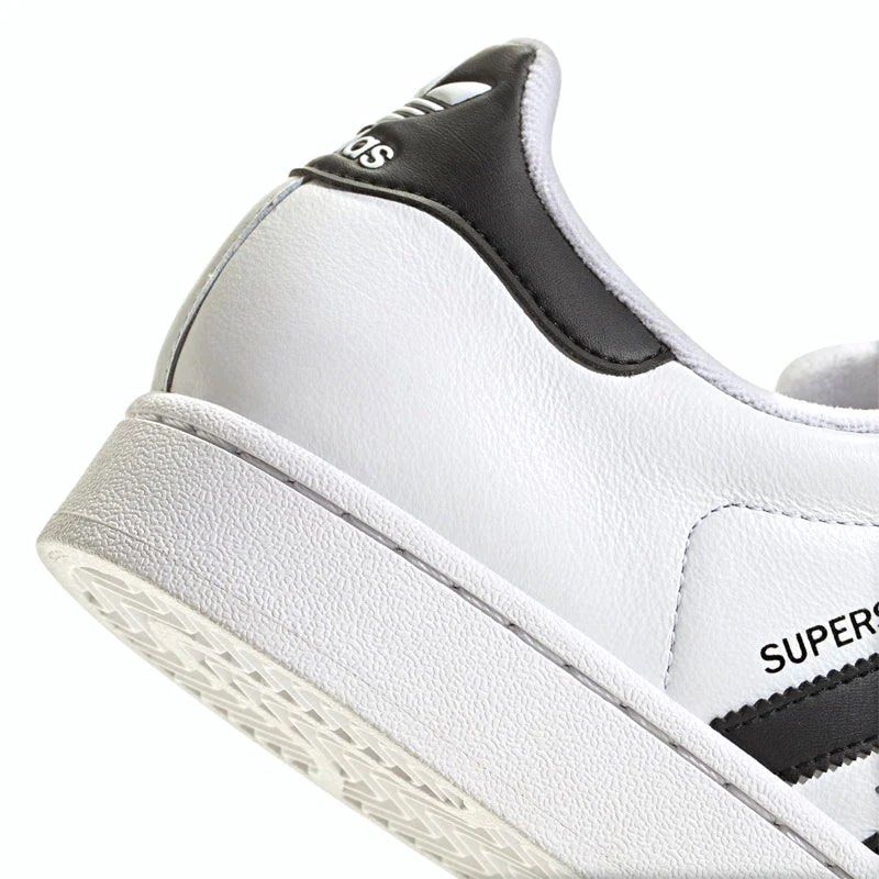 Adidas Superstar White Black Sneakers (Category: Sneakers) located in Pasig City. Submitted by Great_Finds (Listing ID 1405500204, Image 2). Description: - Adidas Superstar sneakers - White with black stripes - Iconic shell toe - Adidas branding on tongue and heel - "SUPERSTAR" printed on side - Clean white sole with black accents - Laced up - US size 11 UK size 10.5 - SRP = P5,500.