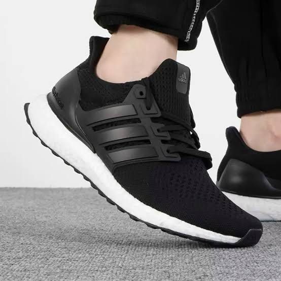 Adidas Ultraboost Black Sneakers (Category: Sneakers) located in Pasig City. Submitted by Great_Finds (Listing ID 1405497820, Image 2). Description: - Adidas Ultraboost sneakers - Black upper with three stripes - White Boost midsole - Lace-up closure - Padded collar for comfort - Heel counter for support - White, cushioned sole - Suitable for running and casual wear - US Size 11 UK 10.5 - SRP = P10,000.